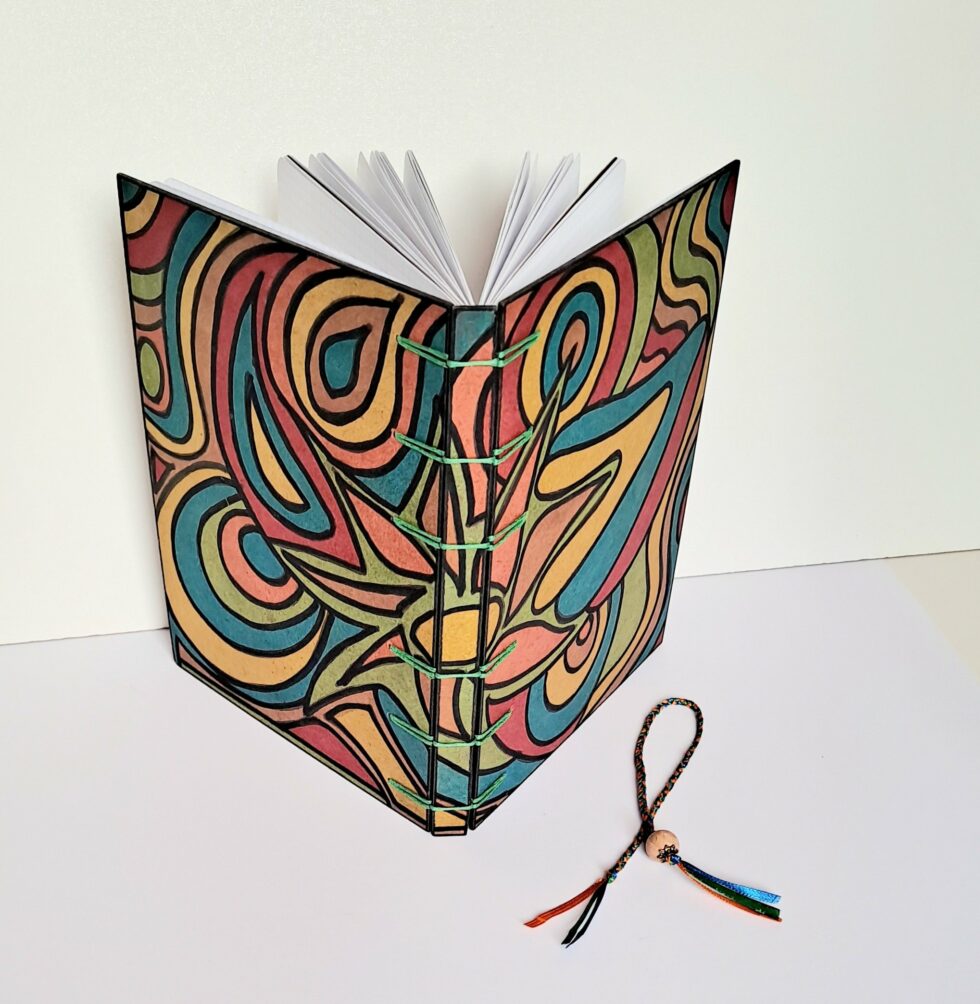 Carnet HARRAGA de face ouvert