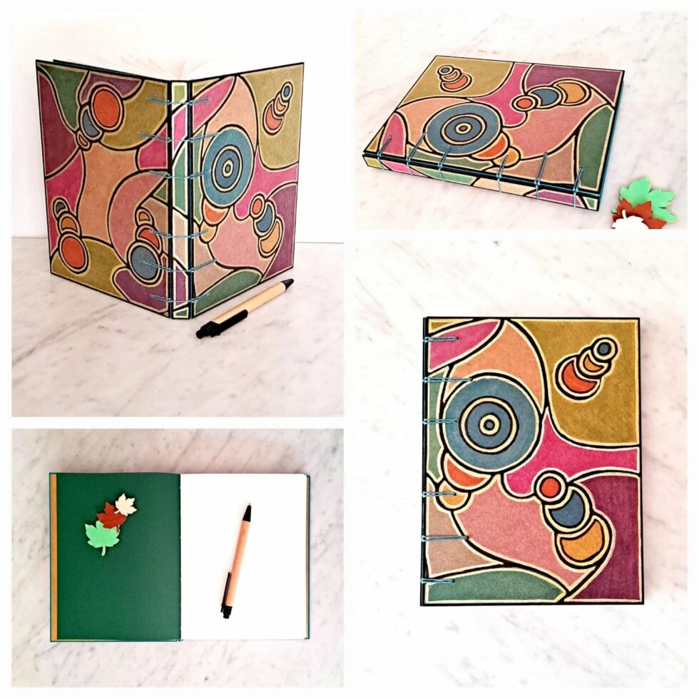 Livre d'Or CAIRN, quatre perspectives du carnet, couverture et pages intérieures.